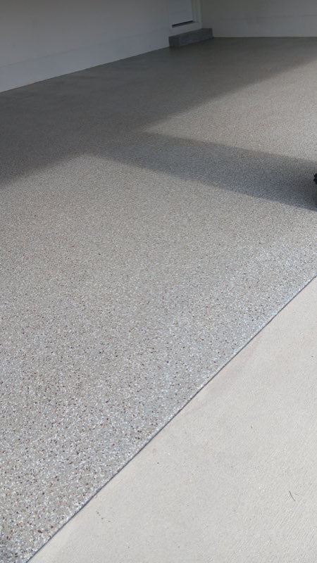 Coated floor meeting the untreated driveway